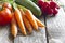 Fresh spring organic vegetables on wooden board