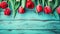 Fresh spring red tulips flowers on turquoise painted wooden planks