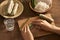 Fresh spring rolls with shrimps with cooker hands on background