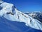 Fresh spring snow and ski trails on the slopes of the Alpine mountain Sex Rouge or Scex Rouge in a Les Diablerets massif