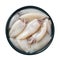 Fresh squid tubes in a blue bowl cutout. Raw calamary fillet on a plate isolated on a white background. Small squids prepared for