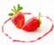 Fresh strawberries as romantic dessert on a plate in heart sha