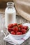 Fresh Strawberries with a Bottle of Milk