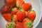 Fresh strawberries in ceramic bowl