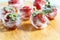 Fresh strawberries frozen in ice cubes, close-up. blurred background