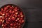 Fresh strawberries into rustic brass bowl