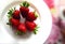 Fresh strawberries on a white plate, Top-down. Close-up