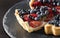 Fresh strawberry, blueberry and raspberry with ricotta tart cake.