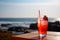 Fresh strawberry cocktail on wood table. Tropic summer vacation. Exotic drinks on blur tropical beach background. generative ai