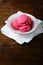 Fresh strawberry macaroon in a white plate