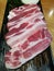 Fresh streaky pork slice serving on the tray, pork belly slice