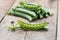 Fresh sugar snap peas on wooden background.