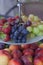 Fresh summer fruits. Organic and natural fruit on tray. Fresh grapes, cheaches, plums and strawberry. Healthy eating.