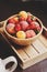 Fresh summer fruits on wooden plate. Strawberries, peaches and apricots