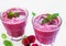 Fresh summer raspberry smoothies with mint leaves