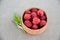 Fresh summer raspberry in a wooden bowl. Selective focus.