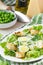 Fresh summer salad with lettuce, eggs, cheese, croutons, green