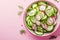 Fresh summer salad with radish cucumbers onion dill and olive oil in a bowl