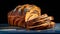 Fresh sweet bread with filling cut on a table close-up on a dark background