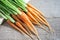 Fresh and sweet carrot on wooden table, Bunch of fresh carrots w