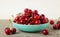 Fresh sweet cherries bowl on grey background, top view