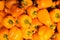 Fresh sweet orange colourful peppers background, aerial view.