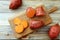 Fresh sweet potatoes on kitchen table background