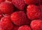 Fresh and sweet red raspberries texture background.