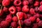 Fresh and sweet red raspberries texture. fruit pile background