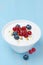 Fresh sweet yogurt with berries and pistachios