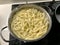 Fresh Tagliatelle Noodels being cooked in a pot of Boiling Water
