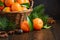 Fresh tangerine clementines with spices on dark wooden background, Christmas concept.