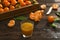 Fresh tangerine oranges on a wooden table. Peeled mandarin. Halves, slices and whole clementines closeup.