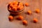 Fresh tangerines and oranges in a clay bowl