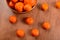 Fresh tangerines and oranges in a clay bowl