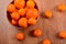 Fresh tangerines and oranges in a clay bowl