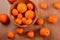 Fresh tangerines and oranges in a clay bowl