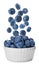 Fresh tasty blueberries falling into bowl