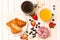 Fresh tasty breakfast with croissant, berries,  donuts, coffee and  orange juice