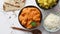Fresh and tasty Butter Chicken served in ceramic bowl. Indian traditional dish
