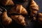 Fresh tasty croissants on black background, culinary delight