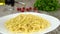 Fresh tasty olive oil pouring on a plate with homemade pasta. Prores, 4K.