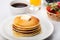 Fresh tasty Pancakes with butter and fruits on