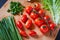 Fresh and tasty tomatoes, salad, onion on cutting board