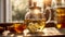 Fresh tea in a glass teapot, chamomile blooming medical healthy alternative herbal beverage hot