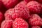 Fresh testy healthy rospberry pile wallpaper. Macro view