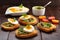 Fresh toasts with pesto and egg on wooden background