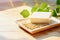 Fresh Tofu cheese with soybeans on wooden table with copy space