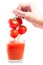 Fresh tomato berry juice pouring into glass
