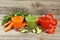 Fresh tomato, carrot and cucumber juice on the grey wooden background